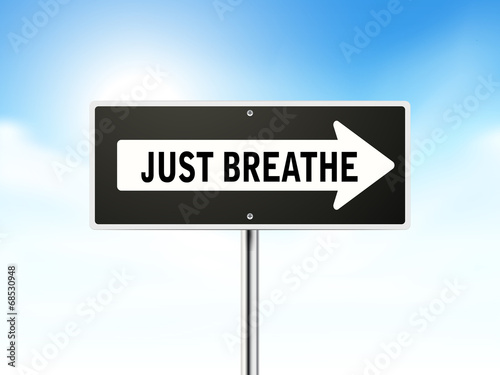 just breathe on black road sign