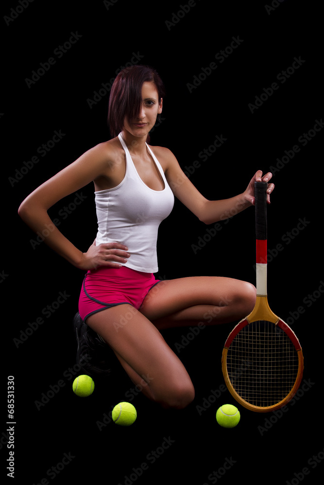 Beautiful young girl with a tennis racquet 