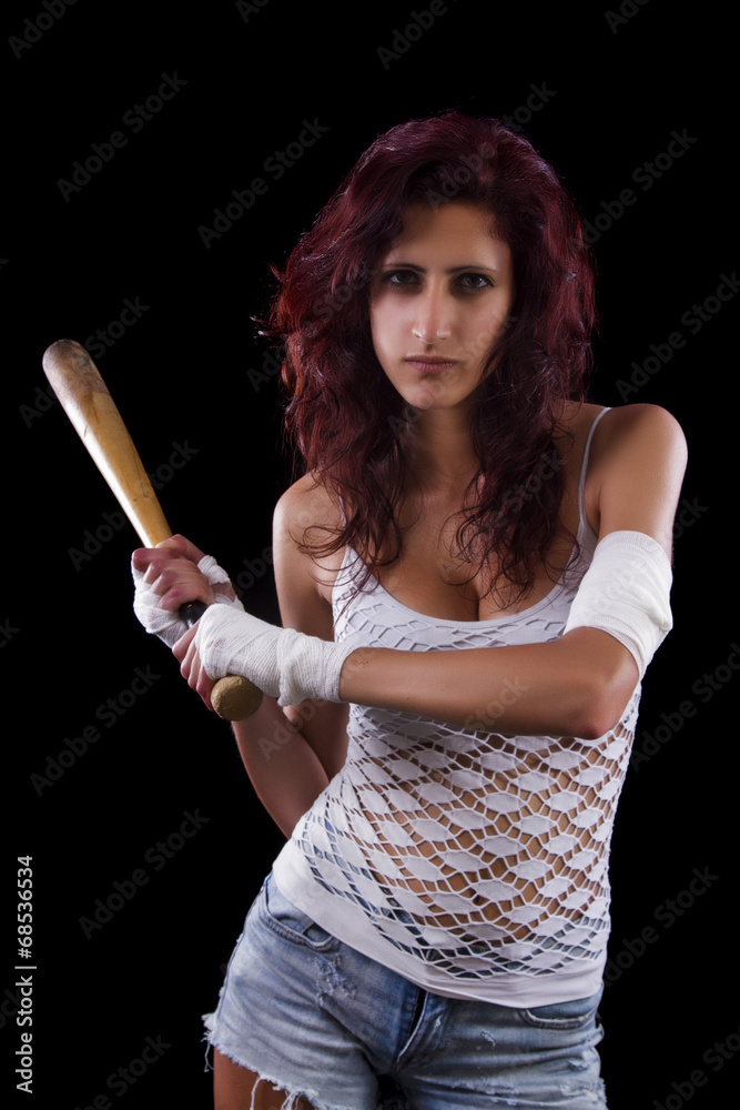 Fearful young street fighter girl on a black background. Fearful young street fighter girl on a black background.
