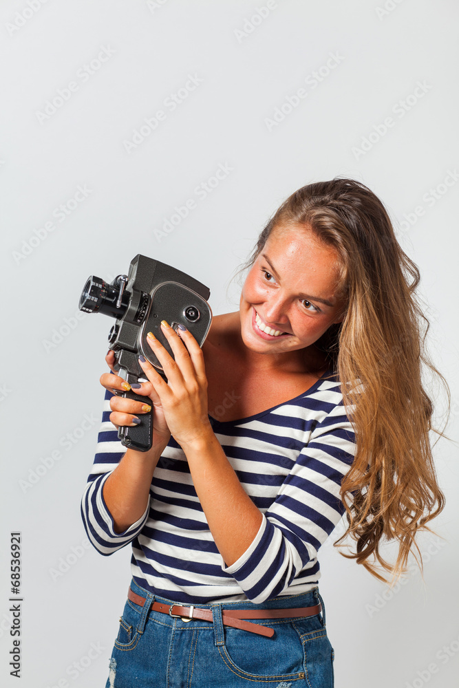 girl with an 8mm retro movie camera girl with an 8mm retro movie camera