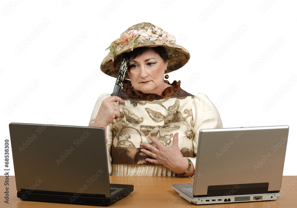Lost in time old woman reading the news on the laptop Lost in time old woman reading the news on the laptop
