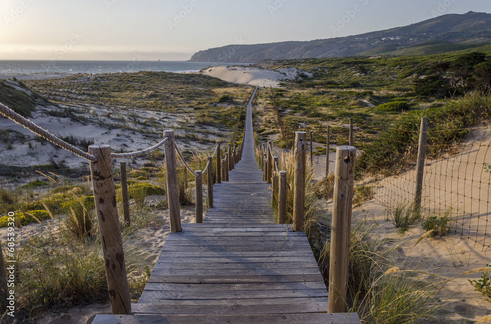 Wooden road at sunset