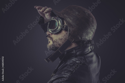 horizon, pilot dressed in vintage style leather cap and goggles