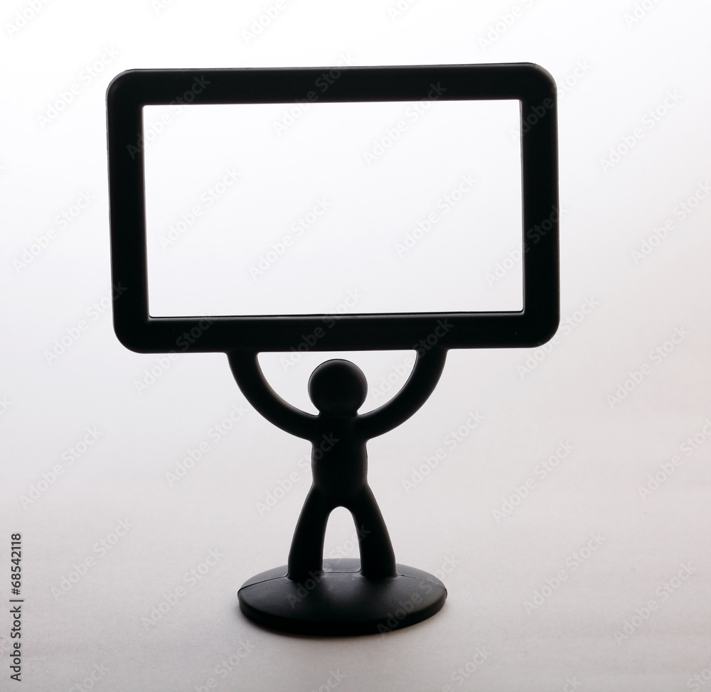 plastic figurine of a man with a placard on white background plastic figurine of a man with a placard on white background