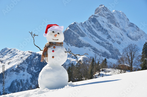 Snowman against Alpine panorama © HappyAlex
