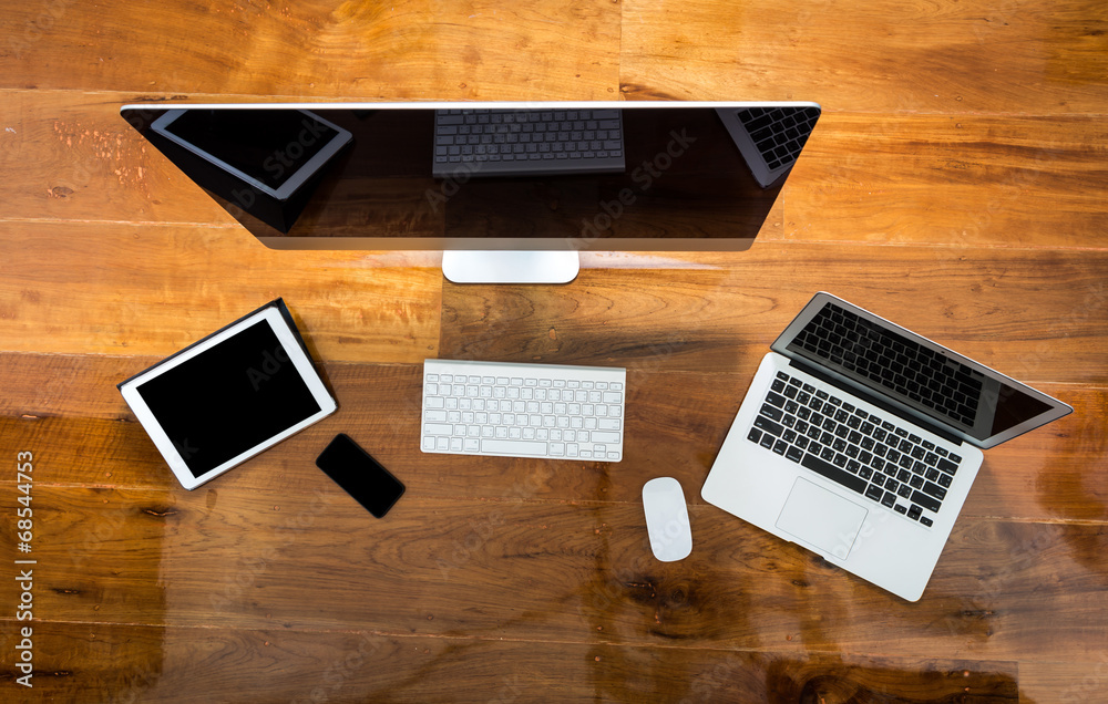 Computer ,laptop , tablet , smart phone on wood table Computer ,laptop , tablet , smart phone on wood table