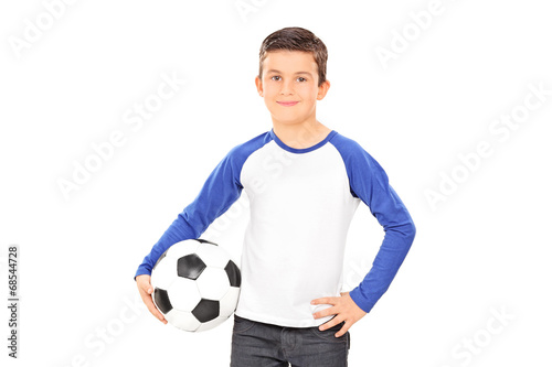 Smiling casual child holding a football