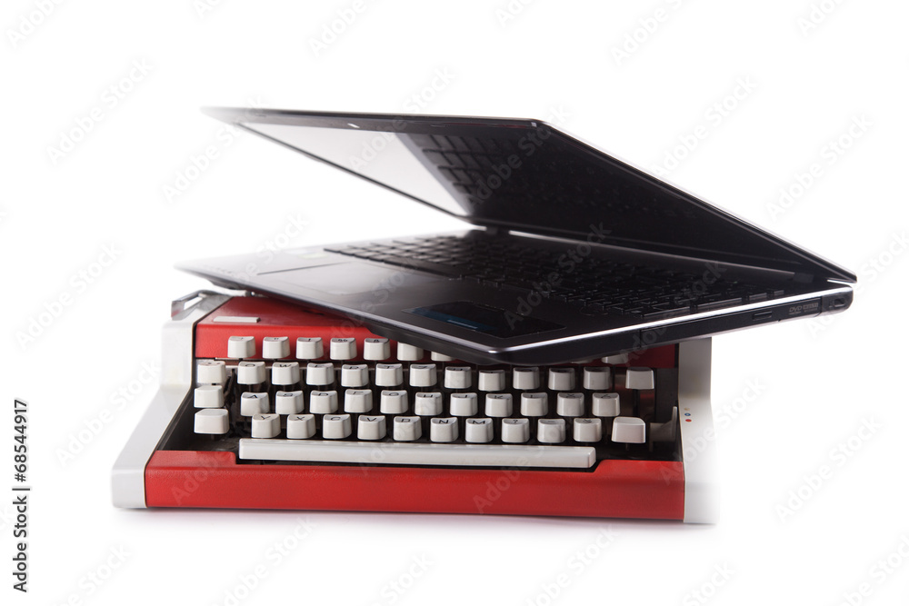 an old typing machine with lap top isolated an old typing machine with lap top isolated
