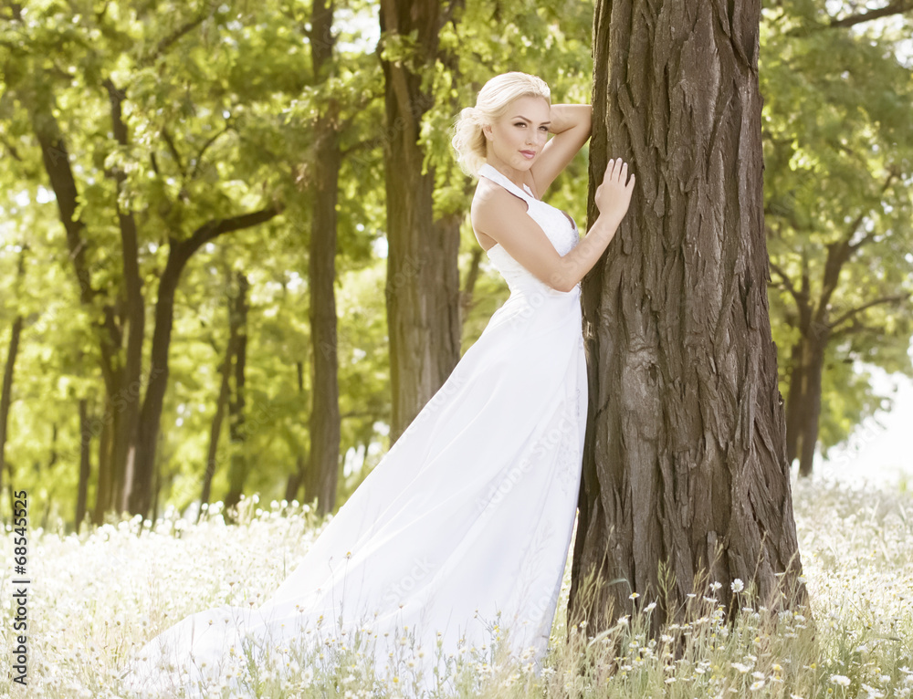 Beautiful bride with stylish make-up in white dress