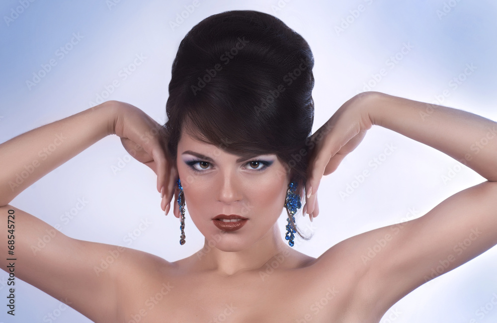 Naklejka premium Portrait of beautiful young woman with makeup