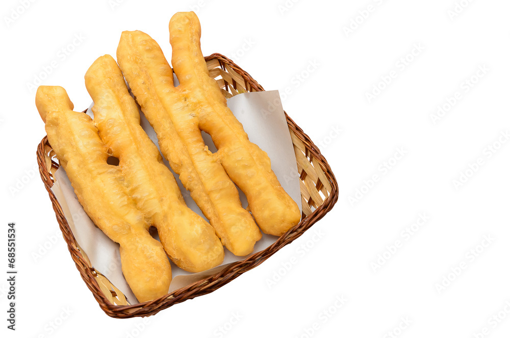 deep-fried dough stick in wooden basket deep-fried dough stick in wooden basket