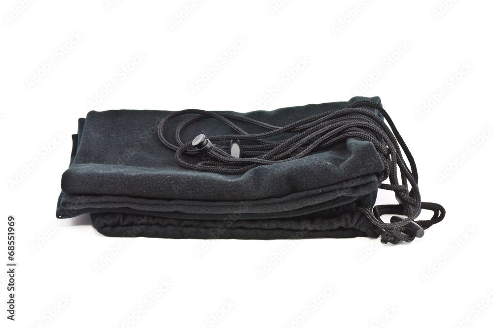 Fototapeta premium Black fabric bag folded on white background