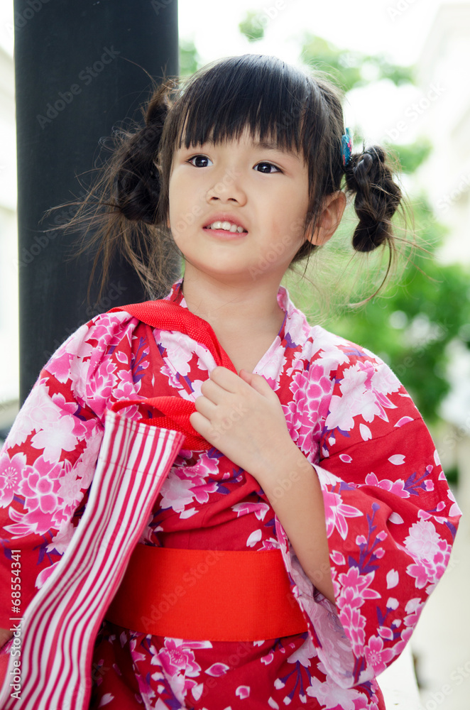 Little asian child in japanese traditional costume Little asian child in japanese traditional costume