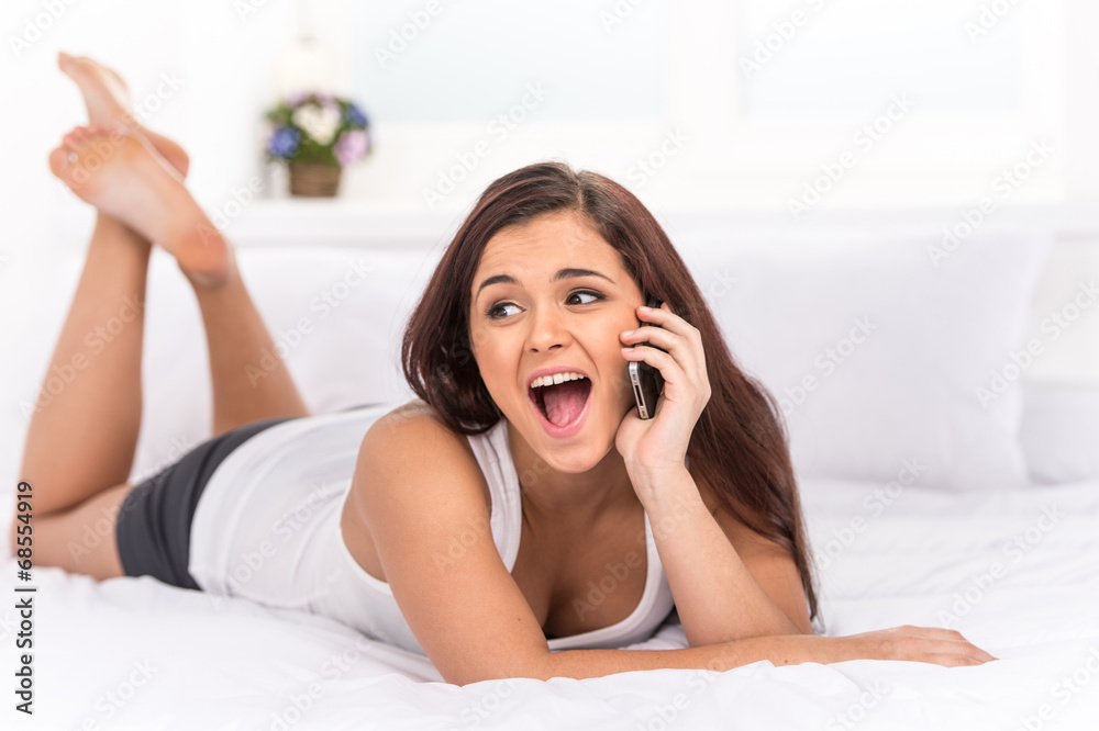 Beutiful happy woman talking at mobile phone. Beutiful happy woman talking at mobile phone.