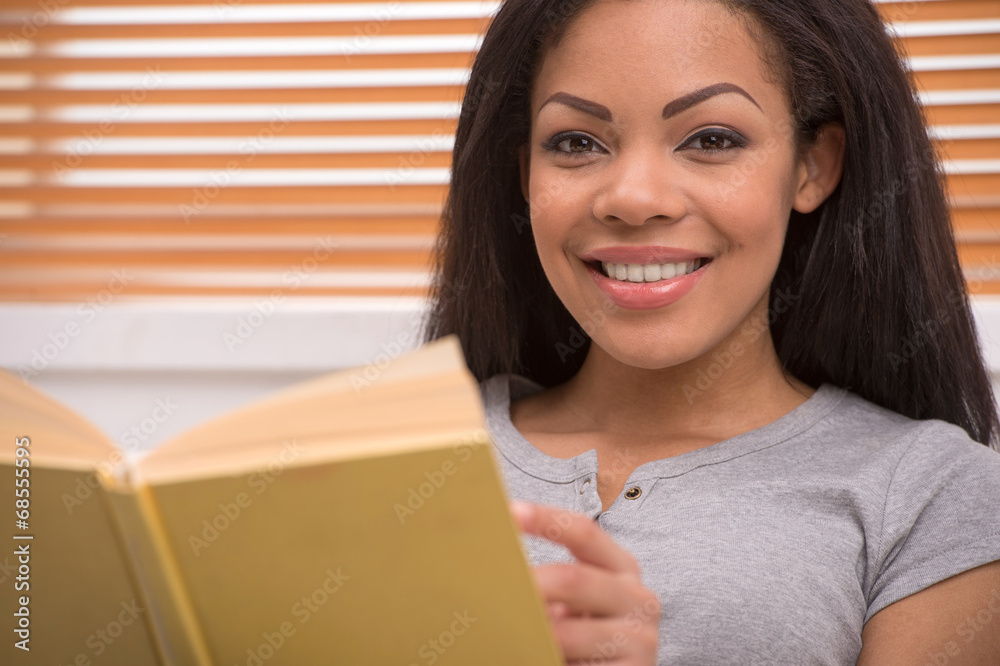 Good looking african american lady looking into camera. Good looking african american lady looking into camera.