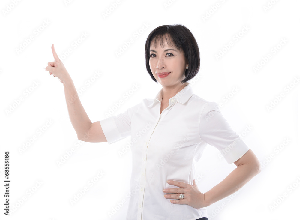 beautiful woman standing casually and pointing to the side beautiful woman standing casually and pointing to the side