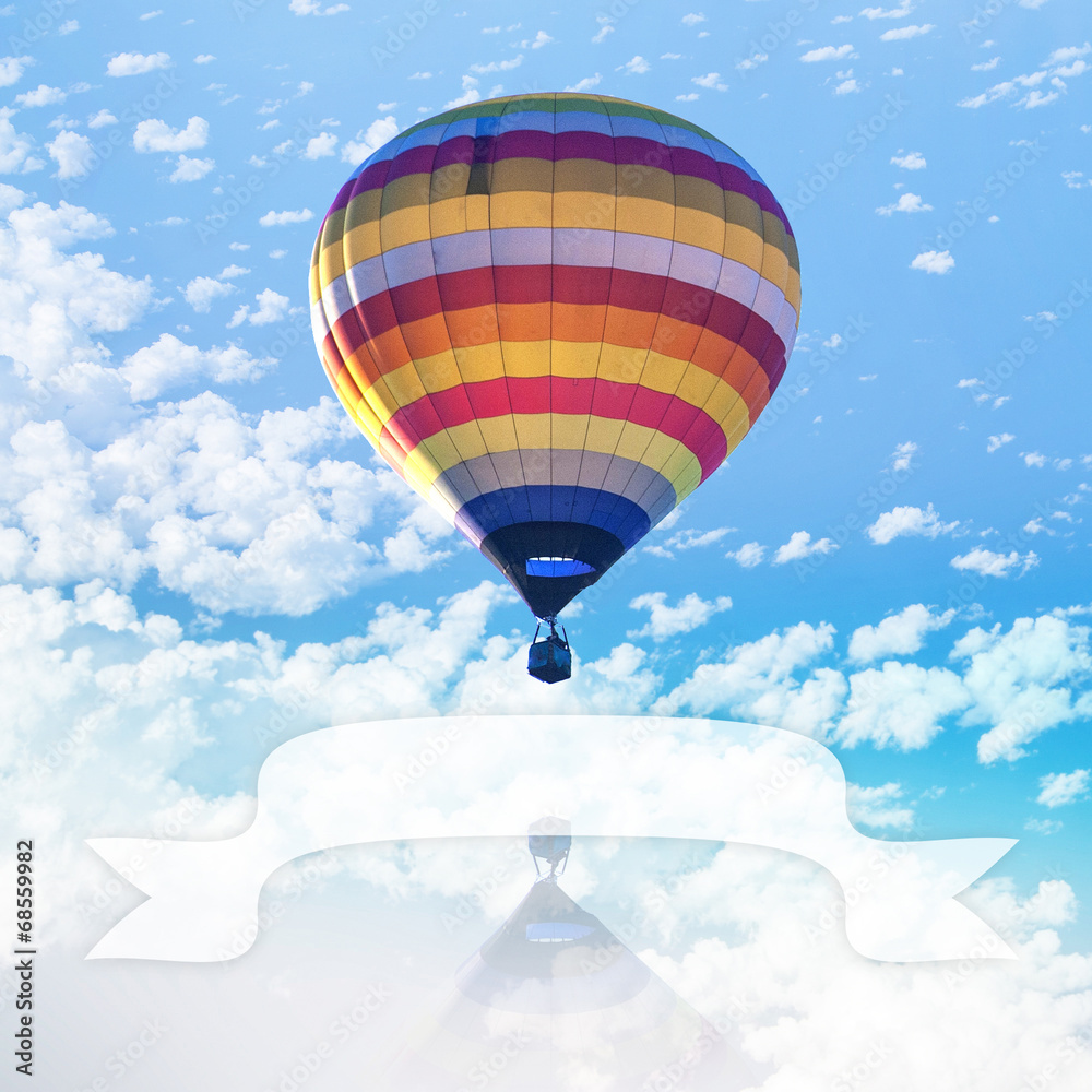 Fototapeta premium Hot air balloon on sea with cloud and blank ribbon for put text