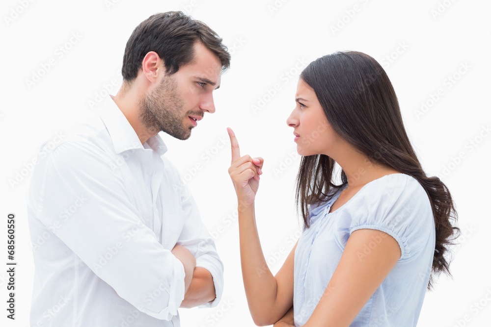 Angry couple facing off during argument Angry couple facing off during argument