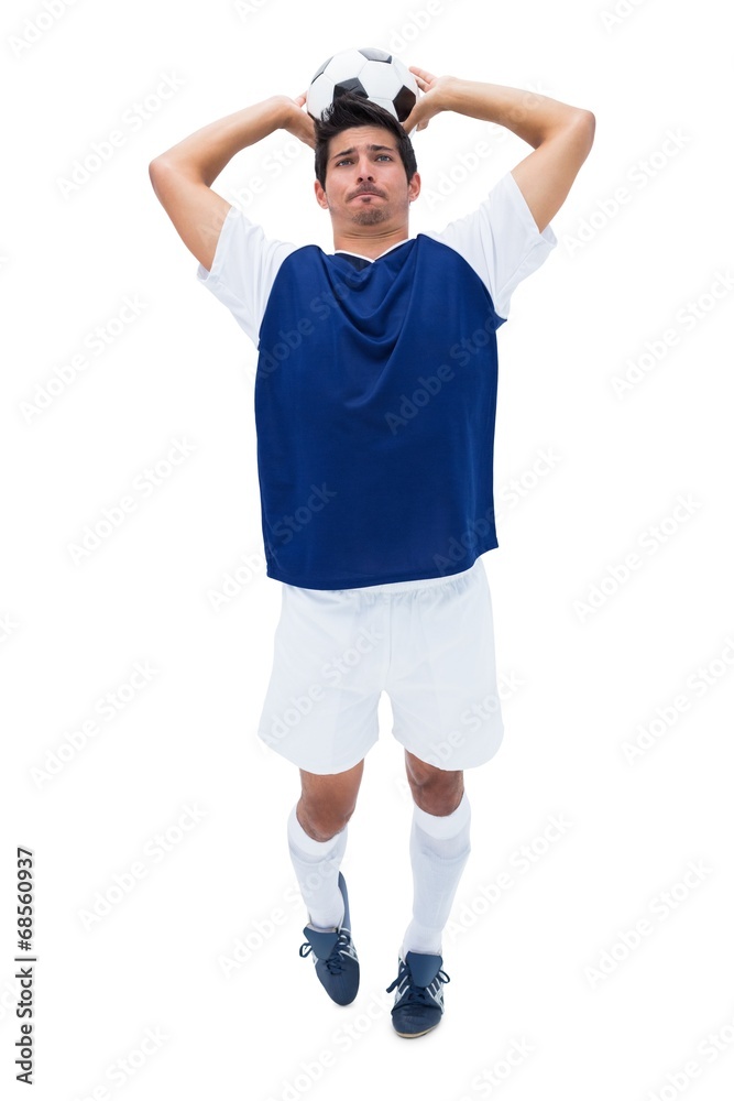 Football player in white throwing ball Football player in white throwing ball