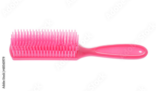 Pink hairbrush isolated on white background.