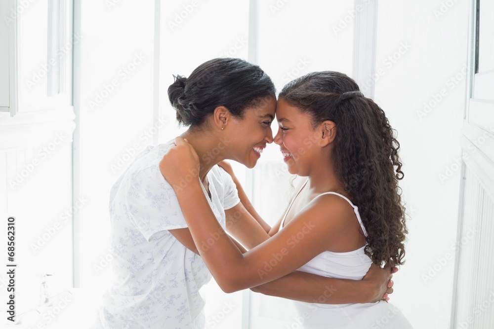 Mother and daughter embracing in the morning Mother and daughter embracing in the morning