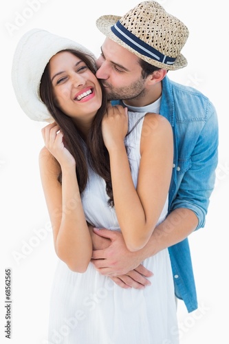 Happy hipster couple hugging and smiling