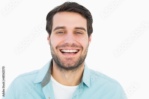 Happy casual man smiling at camera