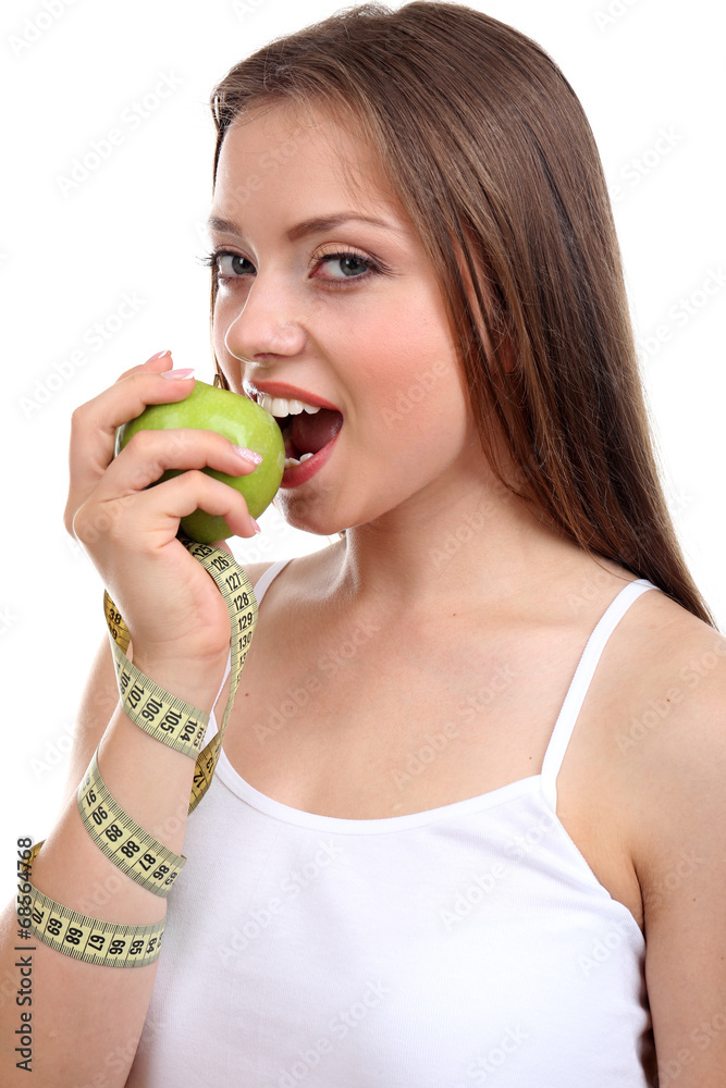 Beautiful girl with apple and measuring tape, isolated on white Beautiful girl with apple and measuring tape, isolated on white
