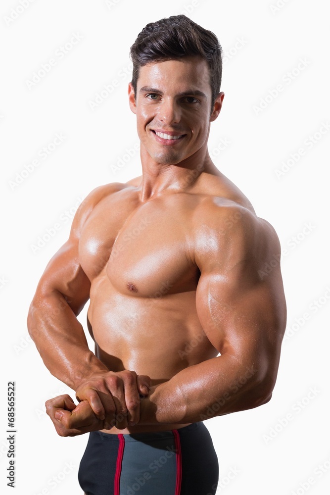 Portrait of a smiling shirtless muscular man Portrait of a smiling shirtless muscular man