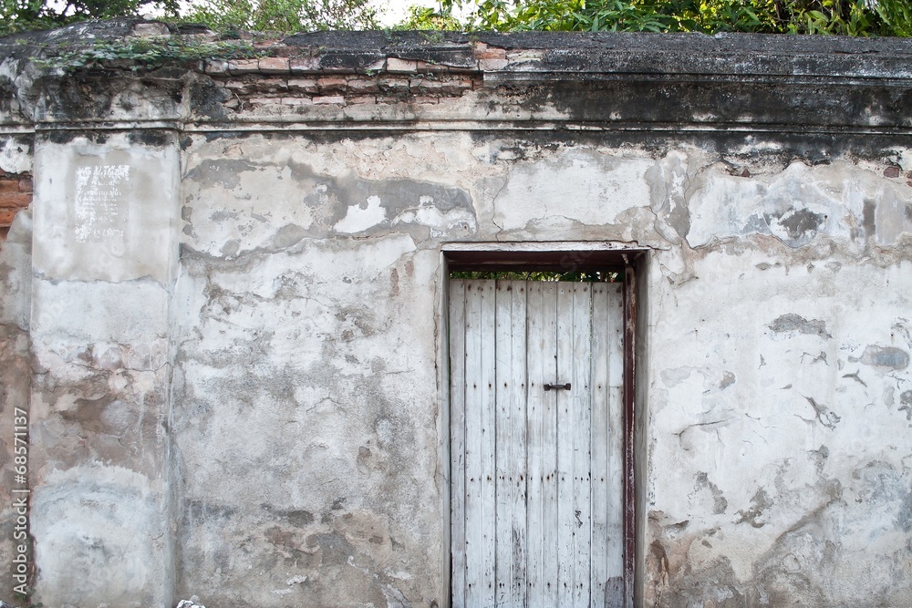 Old door on the old wall.