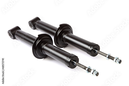 Two car shock absorber on white background. photo