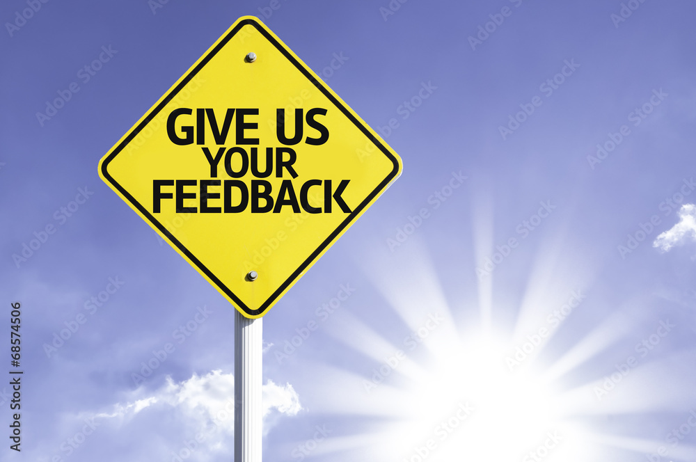 Give Us Your Feedback road sign with sun background Give Us Your Feedback road sign with sun background