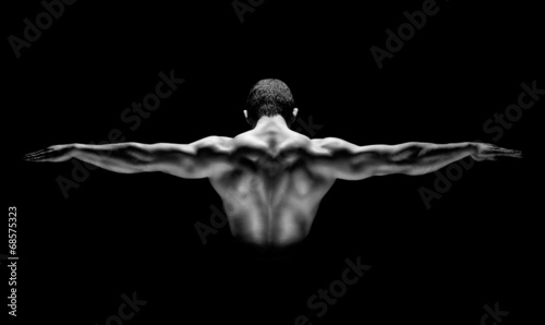 healthy muscular man with his arms stretched out isolated #68575323
