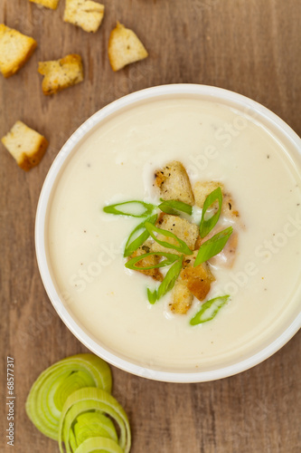 Leek and Potato soup with croutons. Selective focus.