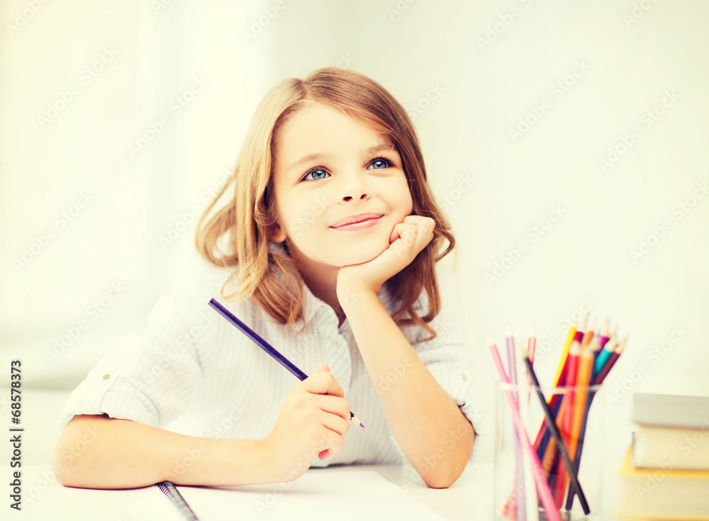 girl drawing with pencils at school girl drawing with pencils at school