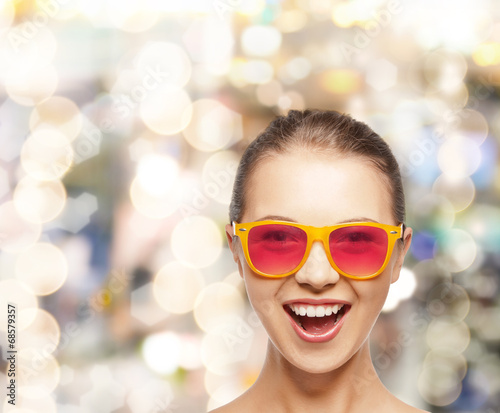 happy teenage girl in pink sunglasses