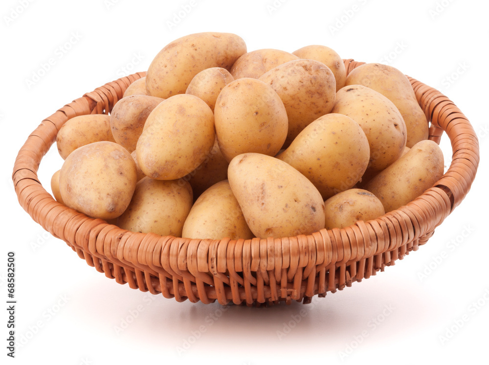 Potato tuber in wicker basket isolated on white background Potato tuber in wicker basket isolated on white background