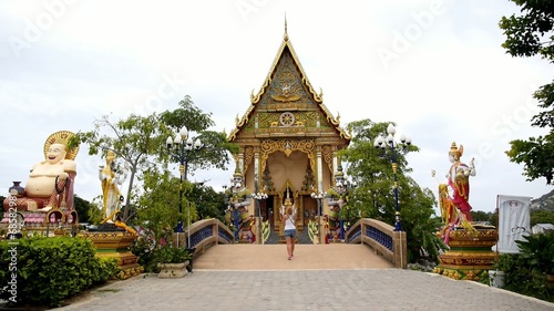 Wallpaper Mural Girl Photographing Buddhist Pagoda, Wat Plai Laem. Torontodigital.ca