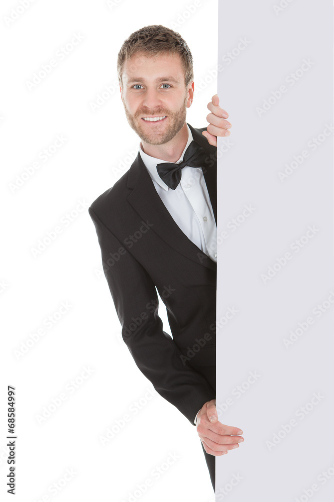 Butler Looking At Blank Billboard Butler Looking At Blank Billboard
