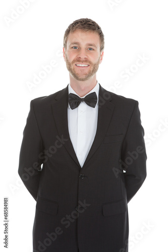 Confident Waiter Standing Hands Behind Back