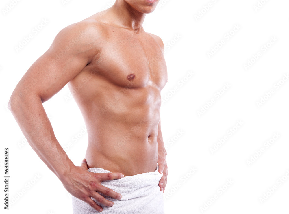 Muscular man in towel, isolated on white background