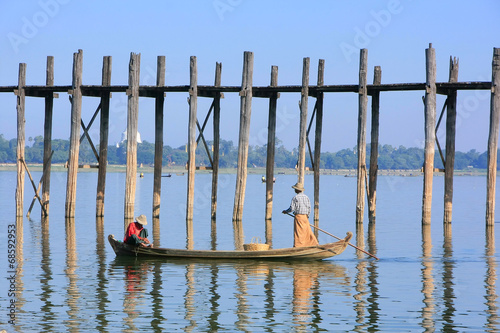 Local people fishing from a boat near U Bein Bridge, Amarapura,