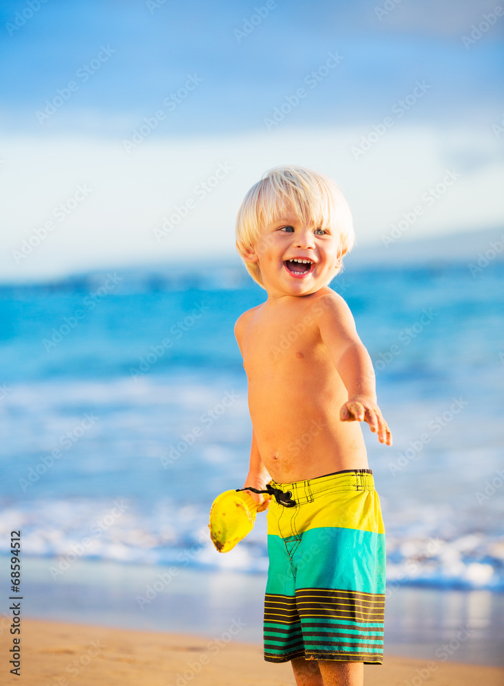 Young boy playing at the beach Young boy playing at the beach