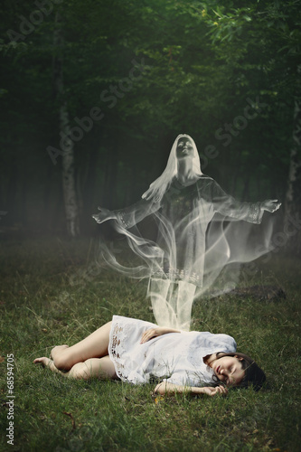 Obraz na plátne Soul of a sleeping woman in a forest