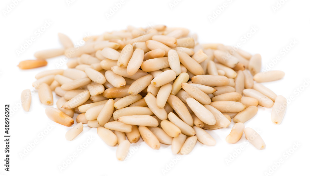 Heap of fresh Pine Nuts over white Heap of fresh Pine Nuts over white