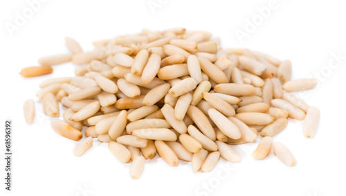 Heap of fresh Pine Nuts over white