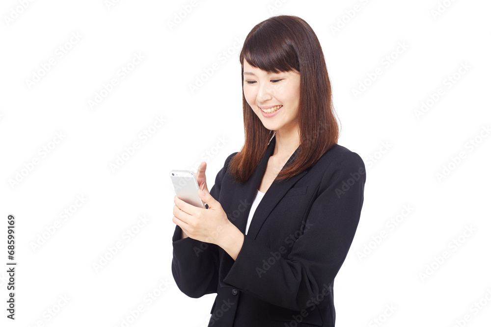 スマートフォンを持って笑うビジネスウーマン スマートフォンを持って笑うビジネスウーマン