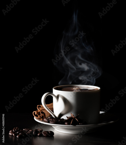 Coffee love. Warm cup of coffee on black background