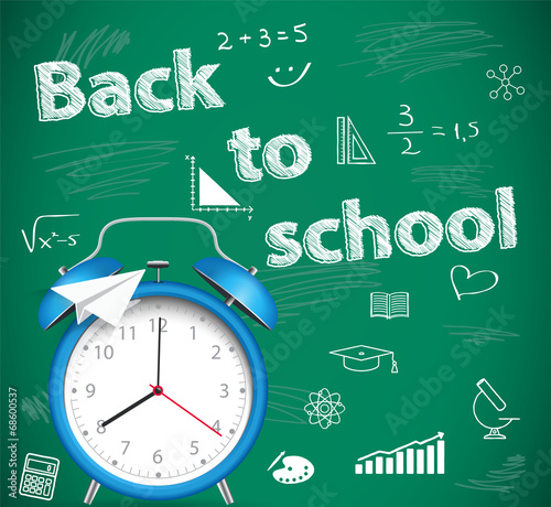 Back to school  green school background with alarm clock