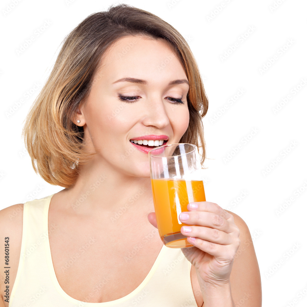 Portrait of a beautiful young woman with a glass of orange juice Portrait of a beautiful young woman with a glass of orange juice